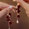 Pendientes de Perlas con Lazo Rojo para Otoño e Invierno Pendientes de Alta Gama para Mujer 2025 Nuevo Estilo Chino Pendientes Rojos