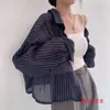 Diseño de camisa a rayas chic coreana para primavera y otoño, camisa ligera de manga corta y larga para mujer, cárdigan de protección solar de verano 2026