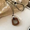 Bolsa pequeña de cuero fresco para gafas, collar con cordón, accesorios de alta gama, moda niche, accesorios nuevos, joyería al por mayor