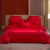 Nuevo conjunto de boda de cuatro piezas 100% algodón bordado 2026, con un diseño lujoso y elegante de algodón de fibra larga, en estilo chino tradicional y color rojo vibrante para bodas