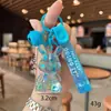 Llavero Creativo de Conejo Sentado de Cristal con Polvo Dorado Colgante Exquisito de Conejito Translúcido Accesorios de Máquina Expendedora Venta al por Mayor