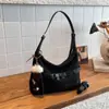 Moda de moda Versátil Gran capacidad Bolso de hombro Bolsos de alta gama Bolso de mano para el trabajo Bolso cruzado único de nicho elegante