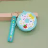 Nuevo Producto en Stock Cartera Creativa de Silicona con Forma de Dona Llavero Lindo de Dibujos Animados para Niños para Aliviar el Estrés Mini Bolso Cruzado