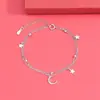 Venta al por mayor de fábrica versión coreana de la pulsera de doble capa de estrella y luna de Mori para mujer diseño nicho ins estrella y luna Pulsera de Estrella