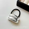 Goma para el pelo plateada minimalista y elegante de alta elasticidad para mujer, nuevo estilo con un aspecto sofisticado, adecuada para coletas y peinados de moño