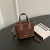 Bolso de mano de moda nicho colección otoño 2026: bolsa cuadrada pequeña para el trabajo y los desplazamientos, bolso de hombro liso, casual y elegante