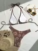 Novo maiô de duas peças com estampa FUSANG transfronteiriço para mulheres, conjunto de biquíni triângulo sexy de cintura alta com amarração no pescoço europeu e americano