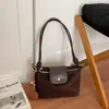 Elegante Bolso de Mano para Empanadas con Acabado Mate para Mujer 2026 Nueva Moda Retro Bolso de Hombro Único Bolso Cruzado Versátil de Gamuza
