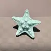 Estilo marino transfronterizo nuevo artículo charm de zapato de estrella de mar concha colgante azul marino hebilla de cordón de zapato compatible con papá de entrenamiento alemán zapatos de ballet