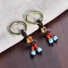 Llavero Retro de Moda Cuerda Trenzada Tejida a Mano Llave Accesorios de Cuentas Azules Agrietadas Colgante Pequeño Regalo Fabricante Mayorista