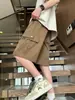 Pantalones Cortos de Herramientas Marrones Estilo Funcional para Hombre Marca de Moda Estilo Americano Retro Casual Pantalones de Verano Delgados Sueltos