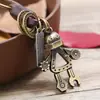 Llavero de Venta Caliente Versión Coreana, Colgante de Llave de Cuero, Robot de Aleación para Hombre, Accesorio de Moda Personalizado de Cuero, Venta al por Mayor