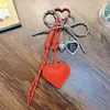 Llavero de Mascota Rojo Colgante para Bolsa de Año Nuevo Llavero de Pareja para Coche Día de Año Nuevo Pequeño Regalo Al por Mayor