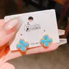 Pendientes de Flor de Cuatro Hojas de Zirconia Turquesa Imitación Retro de Aguja Plateada de Lujo Ligero de Gama Alta Pendientes Clásicos Retro Estilo Chino Nuevo
