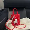 Mini bolso cubeta de lunares estilo coreano para mujer, nuevo modelo 2026, bolso de mano dulce y femenino, bolso cruzado para teléfono versátil de nicho