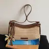 Bolso de mujer tejido a mano de nicho transfronterizo, nuevo modelo de verano 2026, bolso de hombro elegante y a la moda para el trabajo y los desplazamientos, bolso cruzado único