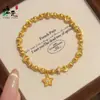 Loja de Ouro Mesmo Estilo Pulseira de Contas Estrela Martelada Olho de Gato Banhada a Ouro com Contas Giratórias e Contas da Fortuna para Mulheres