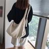 Bolso de lona de color sólido de estilo japonés para mujer, bolso de tela de gran capacidad para estudiantes, bolso cruzado informal de hombro a la moda que combina con todo.