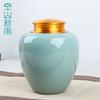 Kongshan Xinyu Creativo Celadón de Longquan Lata de Té Sellada con Tapa Metálica Grande Envase de Cerámica para Té Grabado