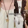¡Estilo de dinero chino antiguo! Collar colgante marrón para mujer, de alta gama, lujo ligero, cadena de clavícula de nicho, accesorio largo para otoño e invierno
