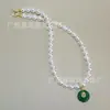 Diseño de nicho collar de perlas colgante calcedonia verde natural gancho de oreja sentido de la moda retro cadena para suéter al por mayor