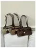 Bolso de axila texturizado transfronterizo para mujer, nuevo modelo 2026, bolso baguette de nicho de lujo ligero, bolso de trabajo, bolso tote vintage esmerilado
