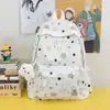 Bolso de hombro doble tipo estrella de alta gama con ambiente estilo bosque versión coreana moderno pequeño fresco estudiante ligero gran capacidad mochila escolar