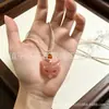 Colgante de flor de durazno de Xinjiang, colgante de Buda, candado de nube auspiciosa de flor de durazno, hebilla de paz de flor de durazno, colgante de jade de zorro de hoja