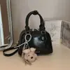 2026 Bolsa de Bolos Portátil Simple Estilo Nuevo Bolsa de Alta Gama Versátil Moderna Elegante Bandolera Cruzada Pequeña Cuadrada