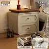 Mesita de noche usada para dormitorio en casa 2026 crema lujo ligero gama alta madera maciza pequeño armario de almacenamiento de mesita de noche para sala de estar