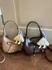 Bolso de Hombro con Lazo Altamente Atractivo 2026 Nuevo Bolso Vintage para el Trabajo de Hombro Cruzado Bolso Único de Color Sólido para el Brazo para Mujer