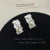 Pendientes de Flor de Circonita con Forma de C Moda Dulce Versátil Moda para el Trabajo Diseño de Nicho Nuevos Accesorios 2025