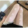 Lazo de Seda Negro Medias de Malla Hueca Negras y Blancas Piernas Hermosas Deseo Puro Japonés Medias Sexy Encaje