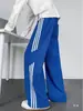 Pantalones de estilo americano con patrón de escamas de dragón en bloques de color para hombre, pantalones deportivos casuales de pierna recta para otoño, pantalones holgados de pierna ancha, modernos y elegantes