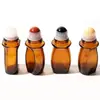 Botella dispensadora de aceite de ricino de vidrio marrón de 30 ml y 50 ml Botella con rodillo de jade de cristal natural Botella con rodillo de cuarzo rosa