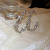 Pendientes de anillo liso transfronterizos europeos y americanos con aguja de plata, pendientes de nicho de viento frío, pendientes de temperamento de moda, lujo ligero, sentido de alta gama
