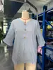 Ropa de mujer nueva de verano 2026 transfronteriza europea y americana Amazon blusa de manga media con botones rayada de volantes cuello en V