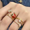 Anillo de dedo índice de flor de cuatro pétalos de insecto Mili de nicho con índice de circonita incrustada, color acero inoxidable, anillo de joyería de moda personalizado para mujer