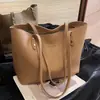 Bolso tote de gran capacidad para mujer, adecuado para otoño e invierno, para ir al trabajo y uso casual, con una sensación de calidad, nuevo bolso de hombro versátil y simple para la clase 2026