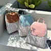 Mochila Nueva a Cuadros 2023 Bolso de Dama Estilo Japonés-Coreano Mochila Escolar para Estudiantes de Comercio Exterior Mochila Grande de Capacidad para Exteriores