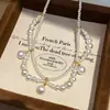 Colar de Renda com Pérolas em Gota de Camada Dupla para Mulheres Exquisita Versátil Corrente de Clavícula Simples Moderno Colar para Mulheres Atacado