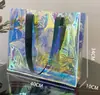 Bolsa de regalo promocional, bolsa transparente, bolsa de exposición de PVC, bolso de mano de moda, bolso de hombro único láser, blanco lechoso, verde claro, azul