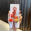 Llavero de Mascota Rojo Colgante para Bolsa de Año Nuevo Llavero de Pareja para Coche Día de Año Nuevo Pequeño Regalo Al por Mayor