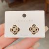 Aretes de Moda de Estilo Coreano con Micro-Incrustaciones de Flor de Cuatro Hojas para Mujer, Aretes Niche de Lujo Ligero con Pétalo Giratorio y Aguja de Plata con Sentido del Diseño