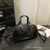 O popular modelo feminino de cor sólida deste ano, o novo modelo de 2026, é uma bolsa transversal de ombro estilosa, estilo vintage, para o verão, tipo bolsa Boston.