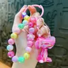 Colgante llavero de conejo acrílico transfronterizo, pulsera de cuentas coloridas, decoración de mochila, regalo decorativo, venta al por mayor de comercio exterior