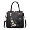 Bolso de mujer de fábrica al por mayor moda bordado bolso de mano para mediana edad 2023 ambiente simple bolso de hombro bandolera bolso de madre