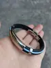 Pulseira de aço inoxidável e silicone transfronteiriça, pulseira esportiva em arco, preto e vermelho, fabricantes de pulseiras para casais europeus e americanos, atacado
