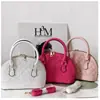 Popular bolsa de concha 2026, nuevo bolso de hombro de moda, bolso de mujer para el trabajo, bolso floral de bordado de hueso para teléfono móvil, bolso cruzado para mujer