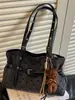 Bolso tote de lunares de nicho de estilo coreano muy elegante, nuevo modelo otoño 2026, bolso de hombro casual de gran capacidad para el trabajo y los desplazamientos